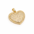 Gold heart-shaped pendant with embedded stones on a white background